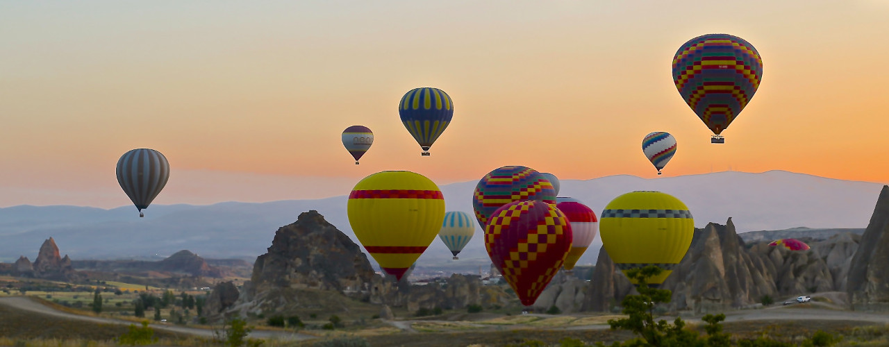 Hot air balloons flying in the sunset